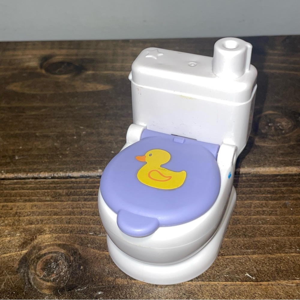 Little people Toilet With Toilet Paper Roll button to pretend flush